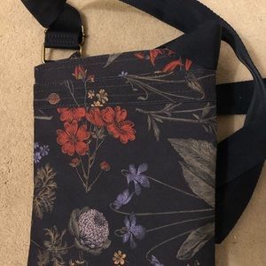 Dakine black floral crossbody pouch. 9 by 10.5”